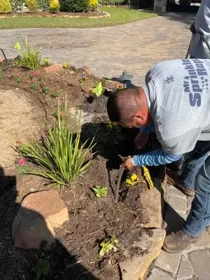 Mr Sprinkler Repair technician working on landscaping in Austin TX